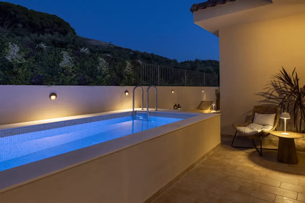 The pool and jacuzzi at Anthos Villa